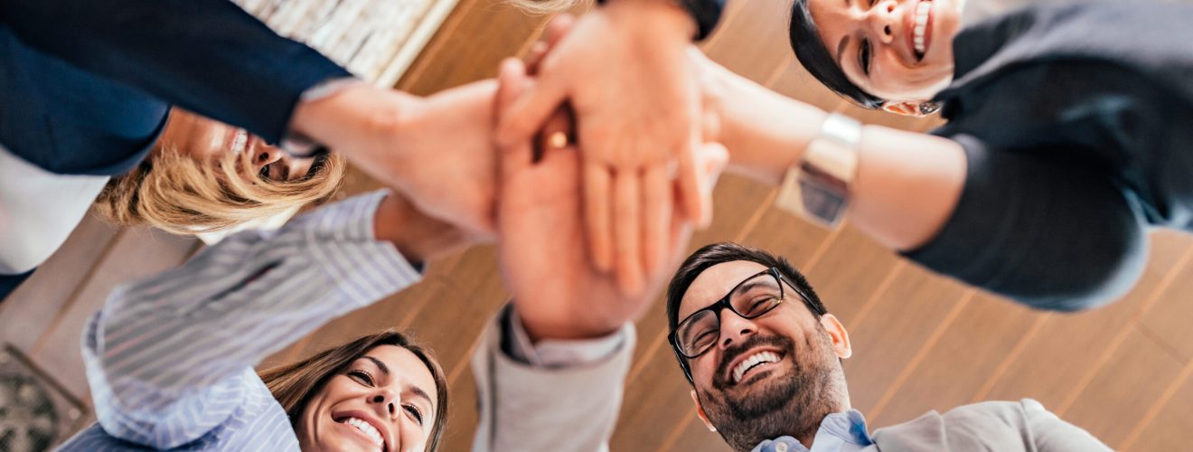 Teamwork concept. Business team joining hands together. bnenin - stock.adobe.com